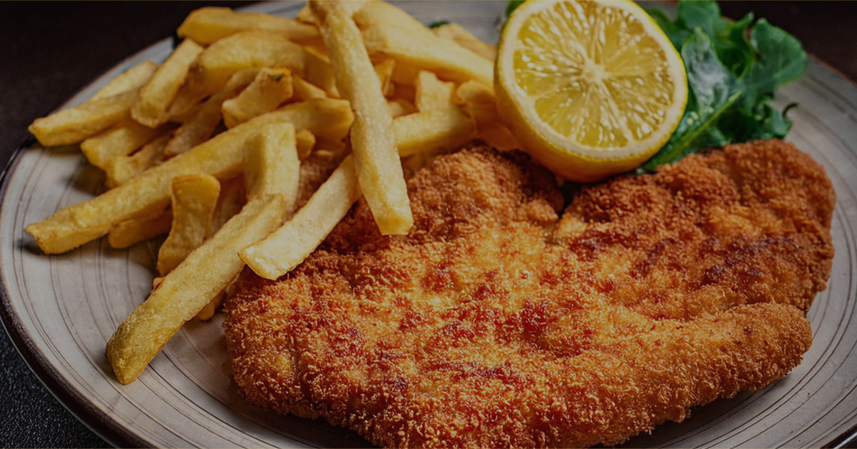 a chicken fried steak with French Fries